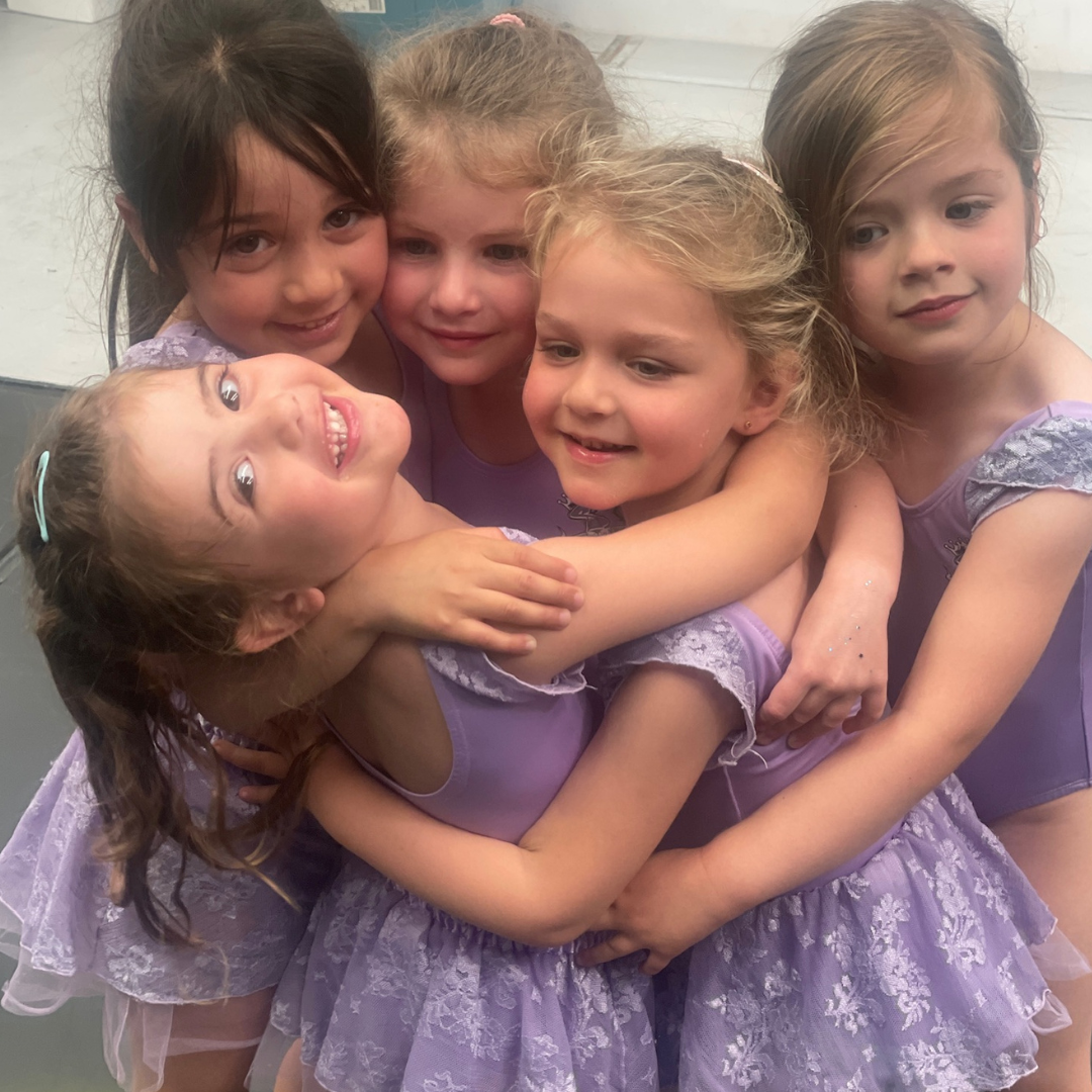 Students in a dance class at Simone's School of Performing Arts building friendships and social skills. Children's dance classes near me, kids dance classes, fostering friendships, and social skills in young dancers.