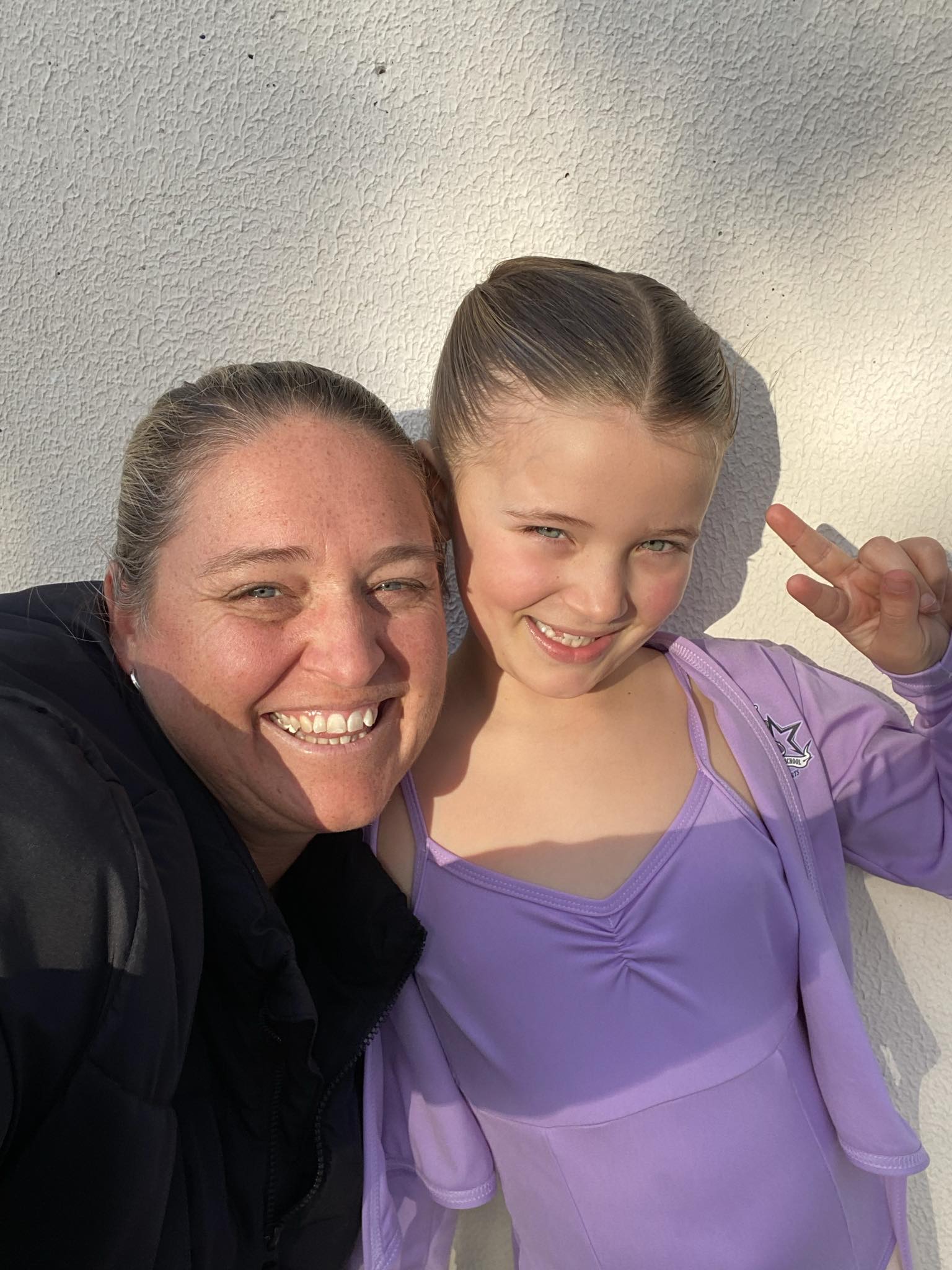 Mother and daughter from Simone's School of Performing Arts enjoying family bonding through dance, showcasing the benefits of parents encouraging their kids to dance for stronger connections and fun.