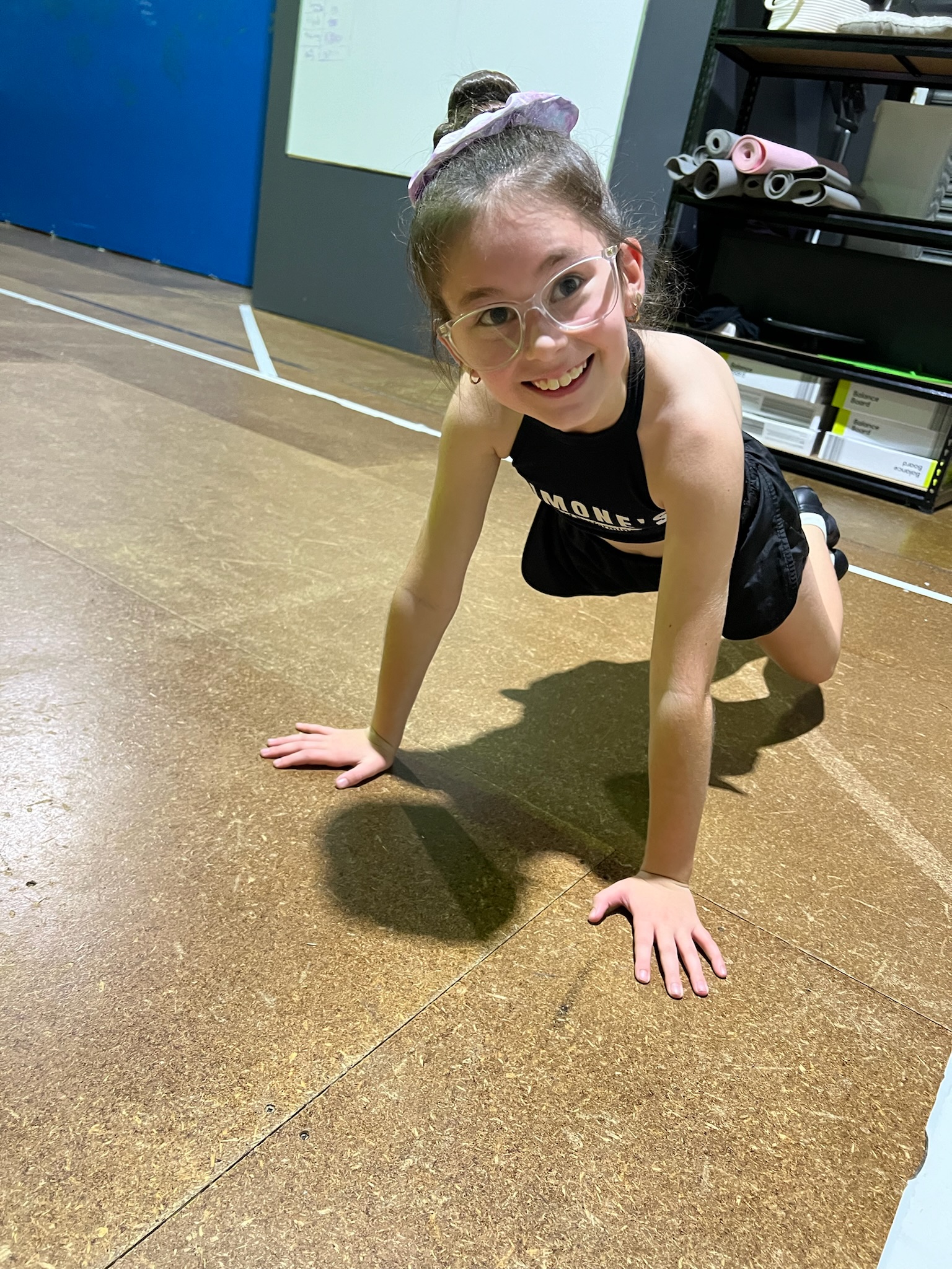 A student from Simone's School of Performing Arts in a dance class, highlighting the benefits of dance for children's physical fitness, improving strength, coordination, and overall health.